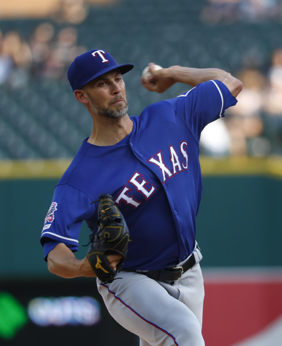 Texas Rangers pitcher Mike Minor throws against the Detroit Tigers in the first inning of a baseball game in Detroit, Wednesday, June 26, 2019. (AP Photo/Paul Sancya)