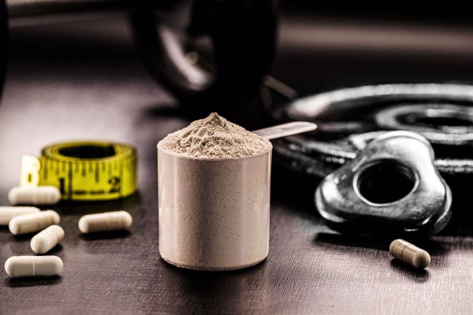 measuring spoon with casein protein supplement powder