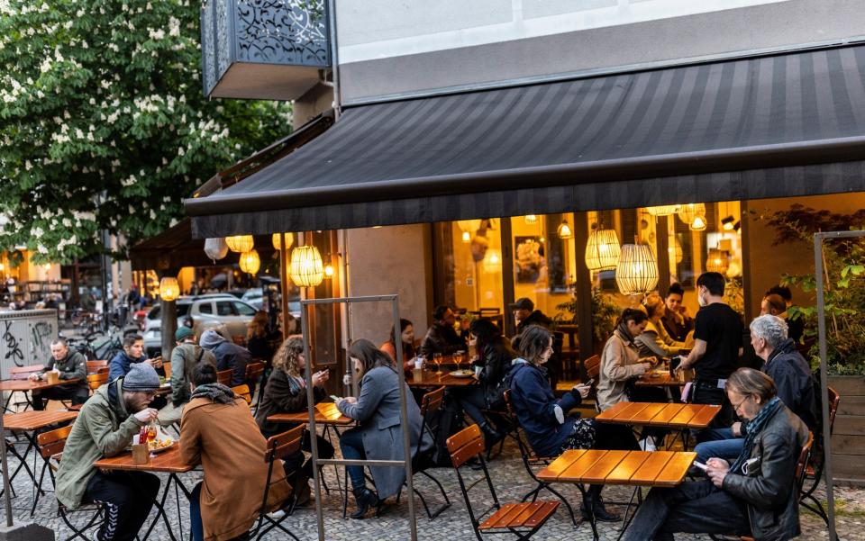 Diners sit outside at a restaurant for the first time this year during the pandemic - Getty Images Europe