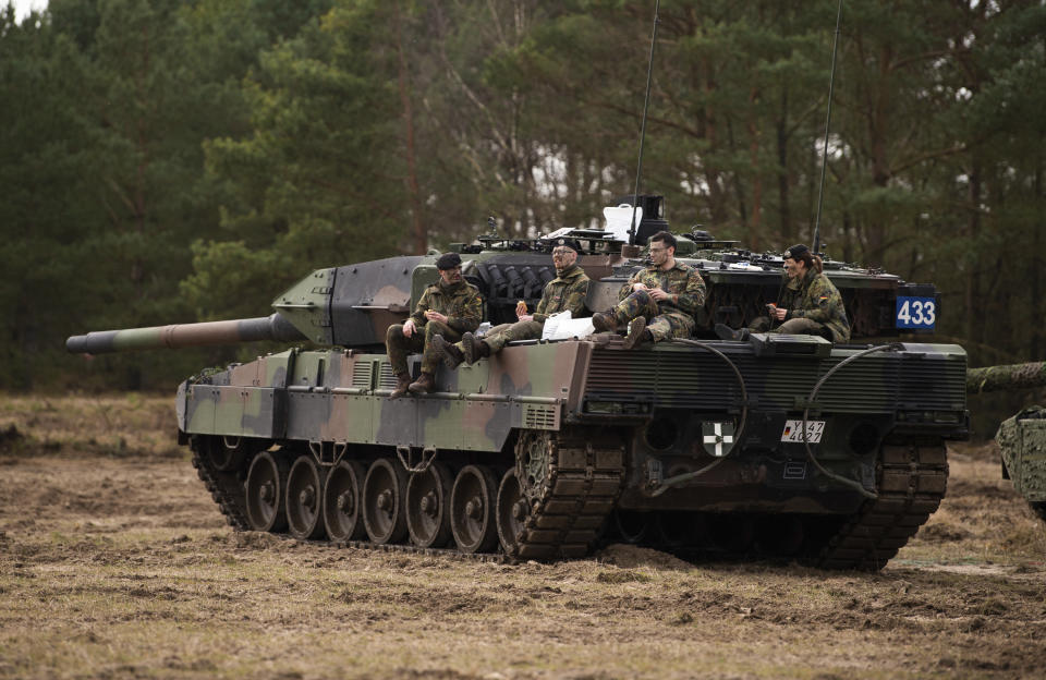 FILE --A crew of the Leopard 2 A7V main battle tank from Bundeswehr training battalion 93, pauses during an exercise at the training area in Munster, Germany, Wednesday, March 16, 2022. (Philipp Schulze/dpa via AP,file)