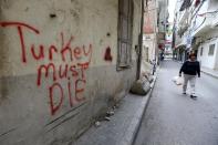 The streets of Burj Hammoud are spray-painted with profanities directed at Ankara