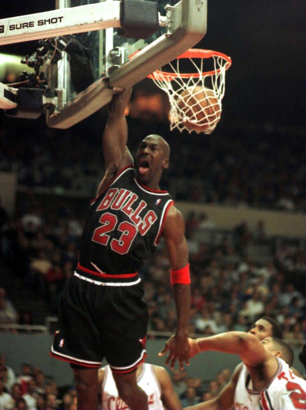 Chicago Bulls guard Michael Jordan jams for two of his game-high 50 points during fourth-quarter action November 21, 1997, to defeat the Los Angeles Clippers 111-102 in two overtimes. On May 16, 1985, the NBA named Jordan rookie of the year after he led all players in points. File Photo by Jim Ruymen/UPI