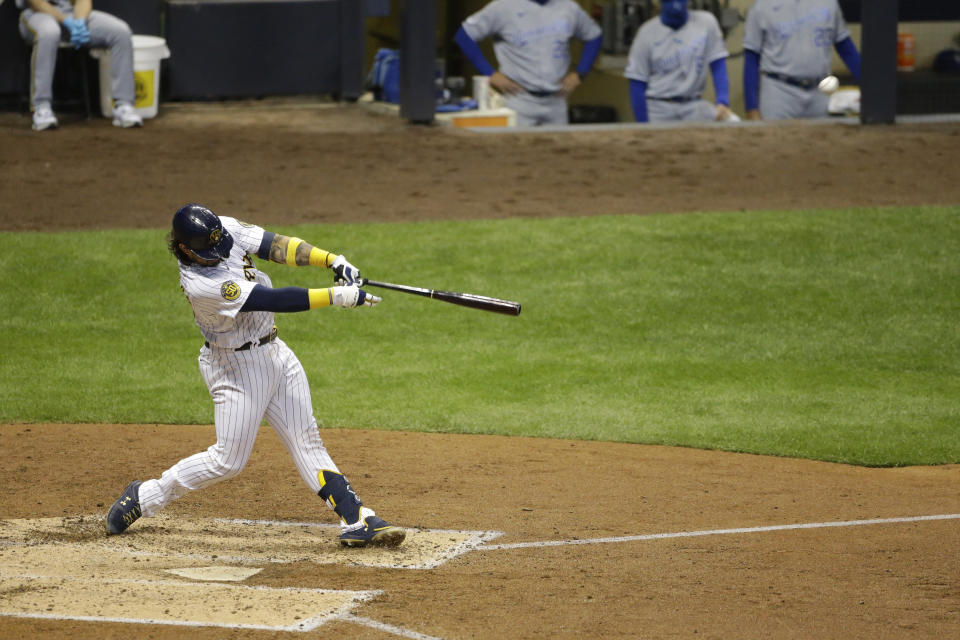 Milwaukee Brewers' Jacob Nottingham hits a grand slam during the fourth inning of a baseball game against the Kansas City Royals, Friday, Sept. 18, 2020, in Milwaukee. (AP Photo/Aaron Gash)