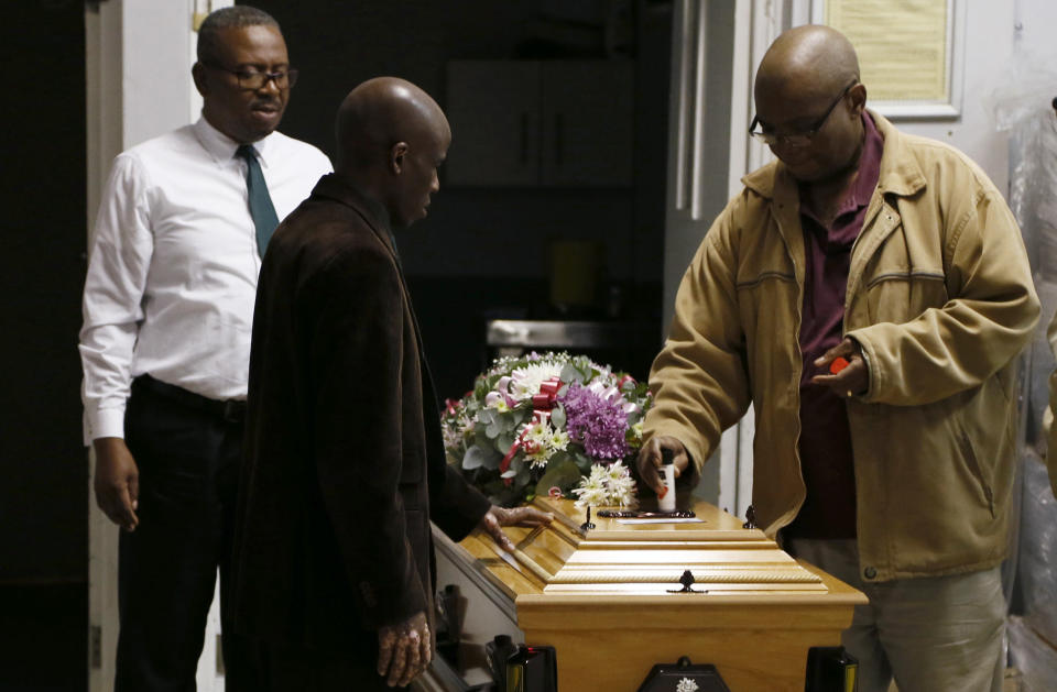 A coffin is prepared to be taken to a symbolic funeral in Scenery Park, East London South Africa, Wednesday, July 6, 2022. South African President Cyril Ramaphosa is to attend the funeral in East London Wednesday for 21 teenagers who died in a mysterious tragedy at a tavern almost two weeks ago. A large tent has been erected for the service expected to be attended by hundreds of grieving family members and residents of East London’s Scenery Park township. (AP Photo)