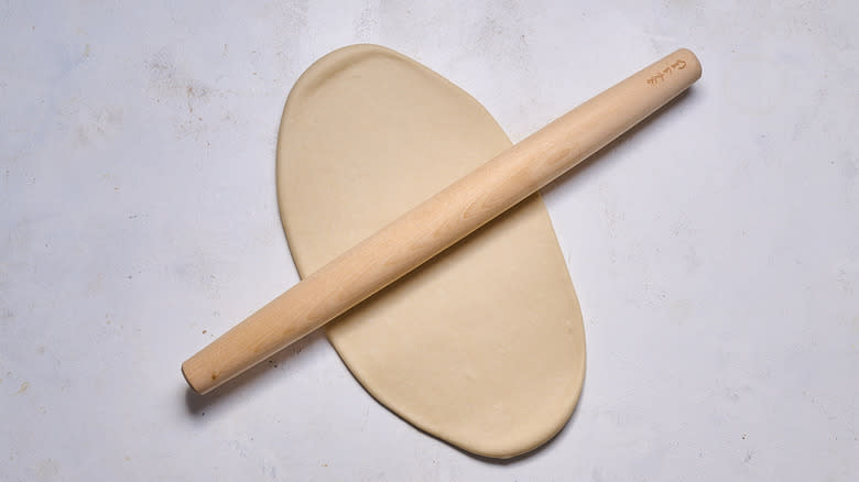 rolling out dough with rolling pin