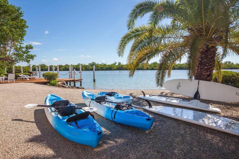 A beach with kayaks at Sea Oats Luxury Estate