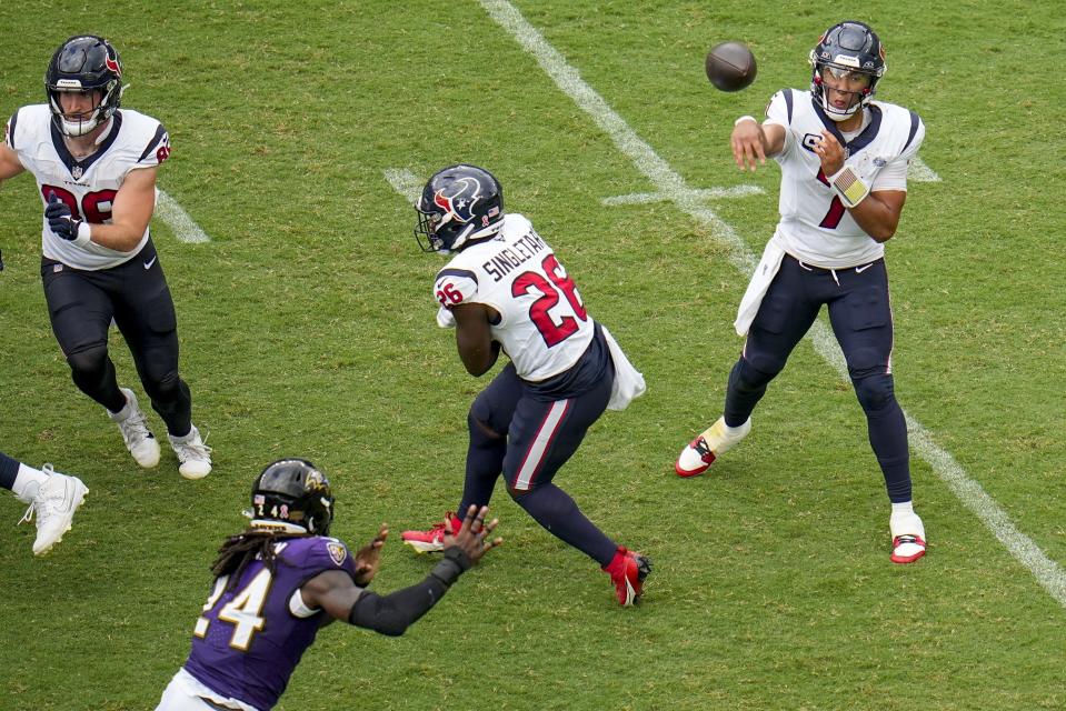 Houston Texans' C.J. Stroud thorws during the second half of an NFL football game against the Baltimore Ravens Sunday, Sept. 10, 2023, in Baltimore. (AP Photo/Julio Cortez)
