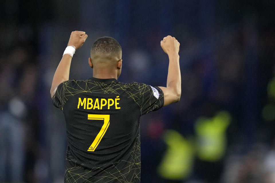 PSG's Kylian Mbappe celebrates after scoring his side's second goal during the French League One soccer match between Auxerre and Paris Saint Germain, at the Abbe Deschamps stadium in Auxerre, central France, Sunday, May 21, 2023. (AP Photo/Thibault Camus)