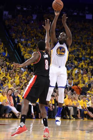 Golden State Warriors forward Draymond Green (23) shoots the basketball against Portland Trail Blazers forward Al-Farouq Aminu (8) during the third quarter in game two of the second round of the NBA Playoffs at Oracle Arena. The Warriors defeated the Trail Blazers 110-99. Mandatory Credit: Kyle Terada-USA TODAY Sports