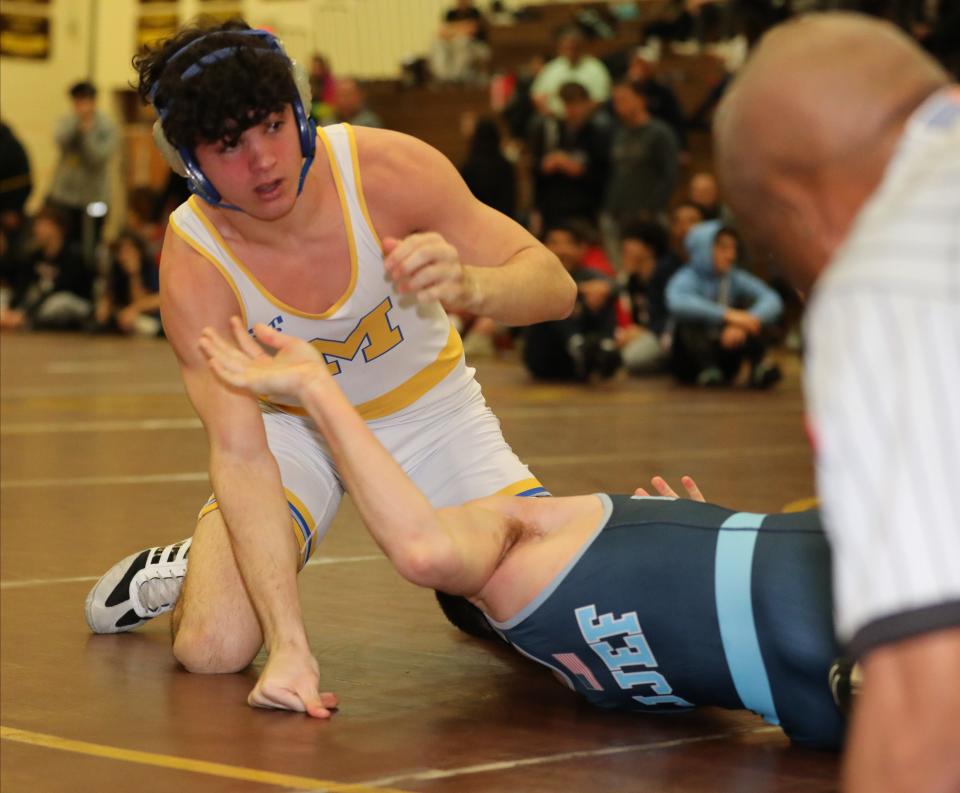 Nicholas Greco from Mahopac on his way to defeating Evan Rossi from John Jay EF in the 160 pound match during the wrestling divisional at Clarkstown South High School in West Nyack, Feb. 3, 2024.