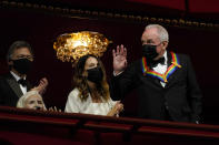 "Saturday Night Live" mastermind Lorne Michaels waves as he arrives at the 44th Kennedy Center Honors at the John F. Kennedy Center for the Performing Arts in Washington, Sunday, Dec. 5, 2021. Seated at left is folk music legend Joni Mitchel. The 2021 Kennedy Center honorees include Michaels, Mitchel, Motown Records creator Berry Gordy, actress-singer Bette Midler, and opera singer Justino Diaz. (AP Photo/Carolyn Kaster)