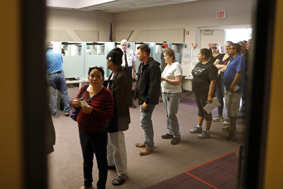 People vote at the Enterprise Library, Tuesday, Nov. 6, 2018, in Las Vegas. (AP Photo/Joe Buglewicz)
