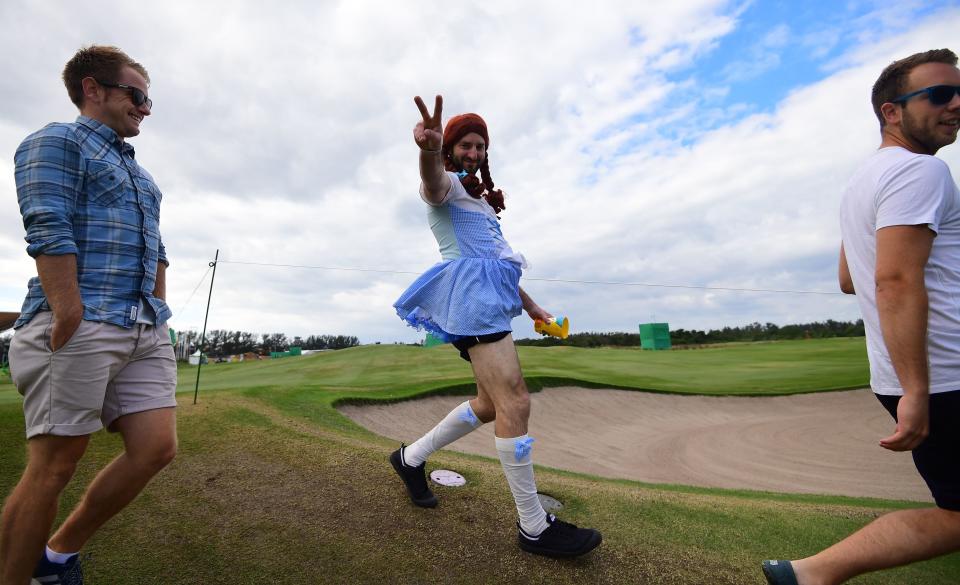 A golf fan wearing a Pippi Longstocking outfit flashes the V-sign during the men's individual stroke play at the Olympic Golf course during the Rio 2016 Olympic Games in Rio de Janeiro on August 11, 2016.