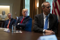 House Minority Leader Kevin McCarthy of Calif., President Donald Trump, and Chevron CEO Mike Wirth listen during a meeting with energy sector business leaders in the Cabinet Room of the White House, Friday, April 3, 2020, in Washington. (AP Photo/Evan Vucci)