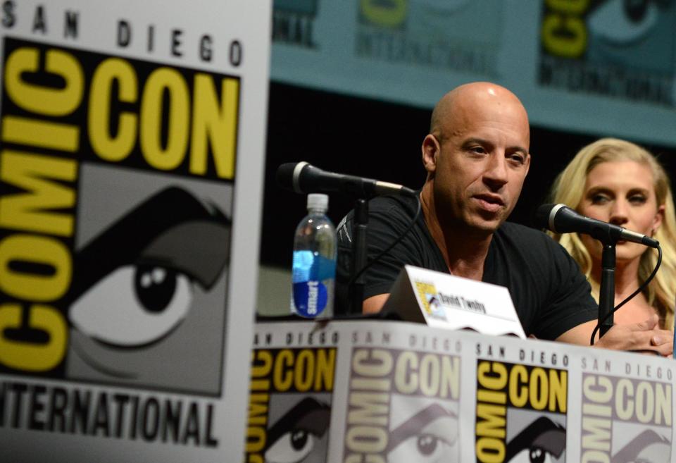 Vin Diesel, left, and Katee Sackhoff attend "Riddick" panel on Day 3 of Comic-Con International on Friday, July 19, 2103, in San Diego. (Photo by Jordan Strauss/Invision/AP)