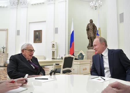 Russian President Vladimir Putin (R) meets with former U.S. Secretary of State Henry Kissinger at the Kremlin in Moscow, Russia June 29, 2017. Sputnik/Alexei Druzhinin/Kremlin via REUTERS