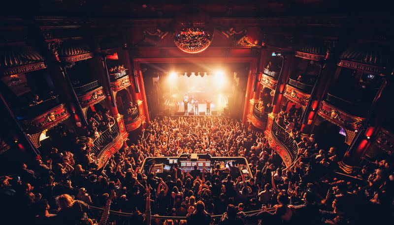 People attend a concert at Koko Theater, in London