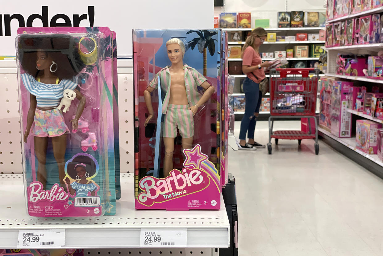 SAN RAFAEL, CALIFORNIA - JULY 25: A customer shops for Barbie merchandise at a Target store on July 25, 2023 in San Rafael, California. Retailers around the world are seeing a surge in sales of Barbie-influenced fashion and accessories as the new movie sets box office records. The Barbie movie brought in $155 million in the first three days of domestic ticket sales. (Photo by Justin Sullivan/Getty Images)