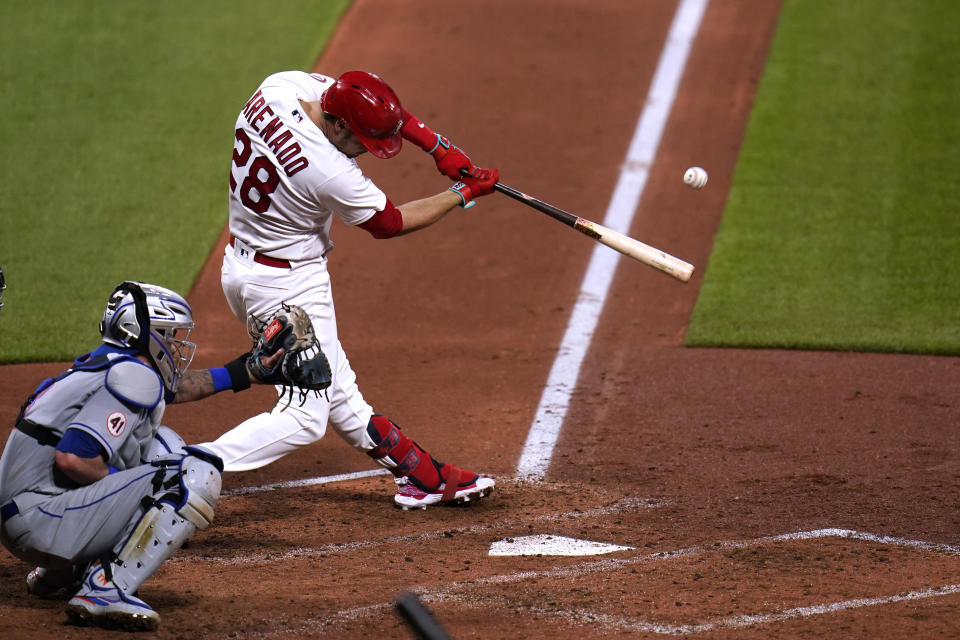 St. Louis Cardinals' Nolan Arenado hits a three-run home run during the third inning of a baseball game against the New York Mets Monday, May 3, 2021, in St. Louis. (AP Photo/Jeff Roberson)