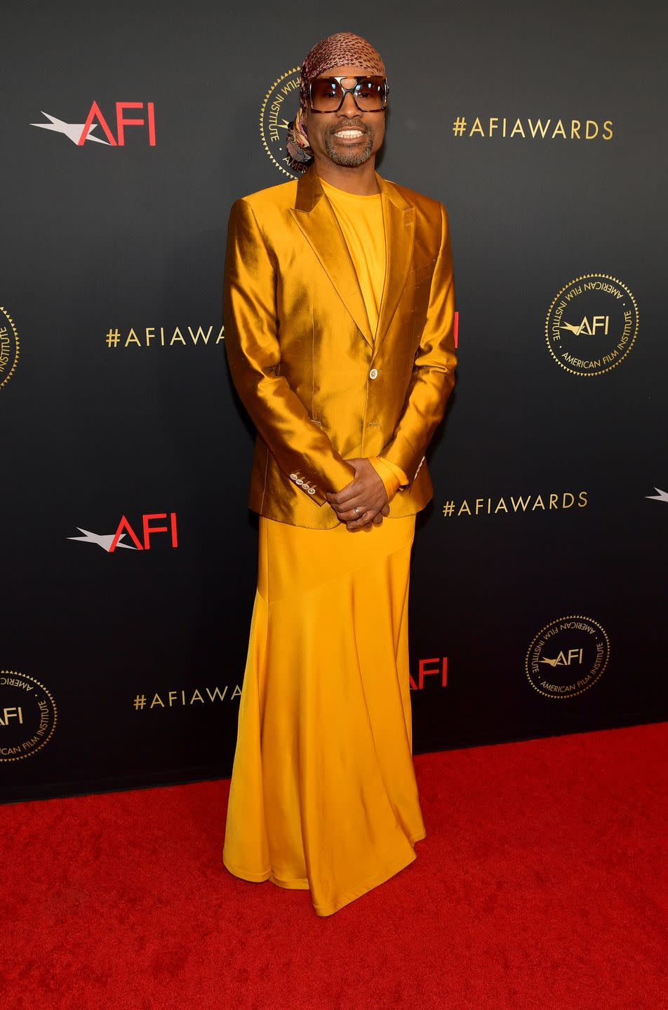<p>Porter wore shimmering burnt orange-coloured Dolce & Gabbana suit jacket and a golden dress by Calvin Klein to the AFI Awards Luncheon.</p>
