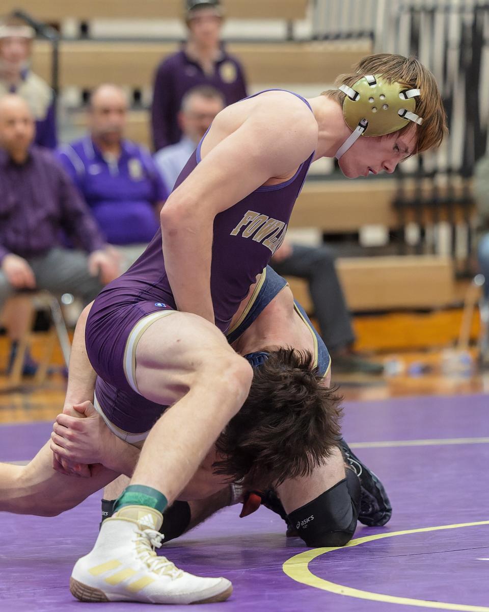 Fowlerville's Brock Foster defeats Chelsea's Massimo Culgliari at 157 pounds in the team district final on Wednesday, Feb. 8, 2023.