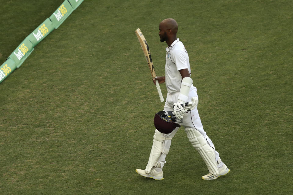 West Indies' not-out batsman Kraigg Brathwaite raises his bat as he walks off at stumps after scoring a century against Australia on the 4th day of their cricket test in Perth, Australia, Saturday, Dec. 3, 2022. (AP Photo/Gary Day)