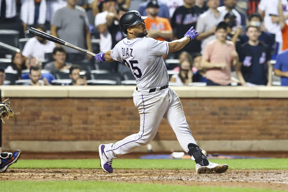 Colorado Rockies' Elias Diaz hits an RBI-double to score two runs against the New York Mets during the eighth inning of a baseball game on Friday, Aug. 26, 2022, in New York. (AP Photo/Jessie Alcheh)