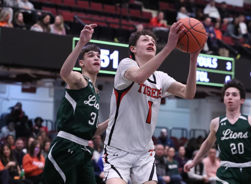 Tuckahoe's Matthew Angello shoots in front of Leffell's Russell Wechsler during a Class C semifinal at the Westchester County Center Mar. 1, 2023. 