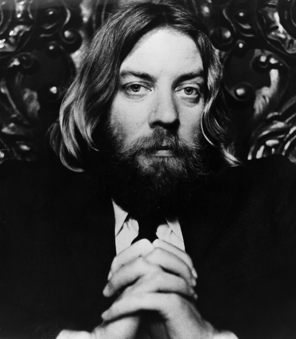 22nd April 1970:  Donald Sutherland playing the shaggy-bearded, long-haired reverend Dupas, a hippie Minister of the First Existenial Church in the film 'Little Murders'.    (Photo by Alan Band/Fox Photos/Getty Images)