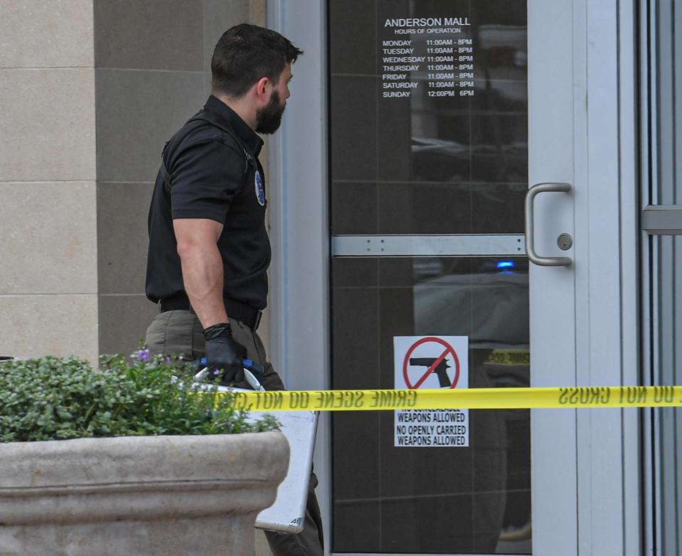 Anderson Police collect information and investigate the scene where a man was shot inside Anderson Mall just after 11:30 a.m. on Saturday, July 9, 2022