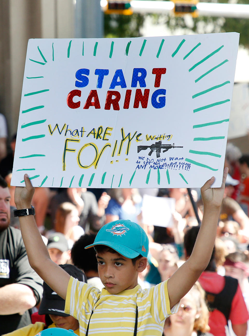 <p>Protesters hold signs at a rally for gun control at the Broward County Federal Courthouse in Fort Lauderdale, Florida on Feb. 17, 2018. (Photo: Rhona Wise/AFP/Getty Images) </p>