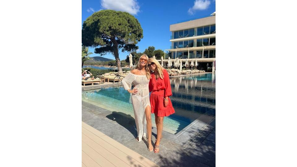 Tess Daly and Naia Beach co-founder Gayle Layton posing by pool in Ibiza