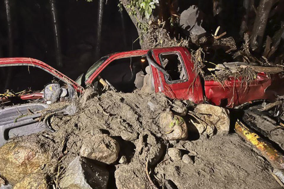 In this photo released by the Siskiyou County Sheriff's Office is the washed away pick up truck of a private contractor who was aiding the firefighting efforts near Klamath River, Calif., Tuesday, Aug. 2, 2022. Amid storms Tuesday the contractor was hurt when a bridge gave out and washed his pickup truck away, said Courtney Kreider, a spokesperson with the Siskiyou County Sheriff's Office. The McKinney Fire was still out of control on Wednesday despite some progress by firefighters who took advantage of thunderstorms that dumped rain and temporarily lowered heat in the parched region. (Siskiyou County Sheriff's Office via AP)