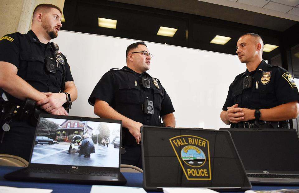 Officer Zachary Vorce, Sgt. Frank Andrade and Lt. Joseph Galvao of the Fall River Police Department man an information table during Fall River's Job Fair on Wednesday, Aug. 30.