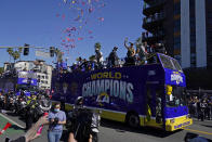 Los Angeles Rams wide receiver Cooper Kupp waves as he rides on a bus during the team's victory parade in Los Angeles, Wednesday, Feb. 16, 2022, following their win Sunday over the Cincinnati Bengals in the NFL Super Bowl 56 football game. (AP Photo/Marcio Jose Sanchez)