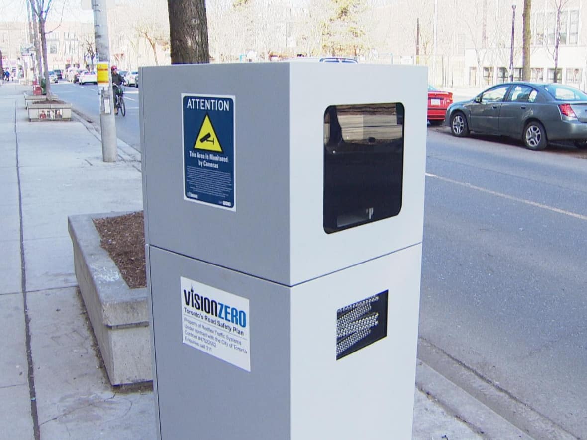 This 'automated speed enforcement' camera is among 50 placed in wards around the city as part of the Vision Zero program, which aims to eliminate fatalities and serious injuries on city streets. The city has collected $34 million fines from the cameras since 2020.   (CBC - image credit)