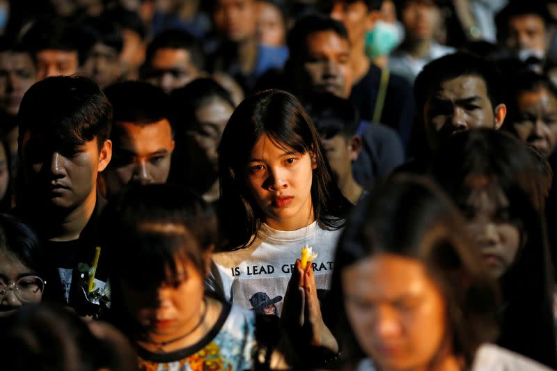 sPeople gather as they pray for victims who died in mass shooting, involving a Thai soldier on a shooting rampage, in Nakhon Ratchasima