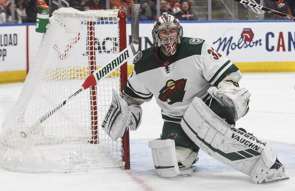 Minnesota Wild goalie Alex Stalock loses his stick as a bad bounce goes into the net for an Edmonton Oilers goal during the second period of an NHL hockey game Friday, Feb. 21, 2020, in Edmonton, Alberta. (Jason Franson/The Canadian Press via AP)