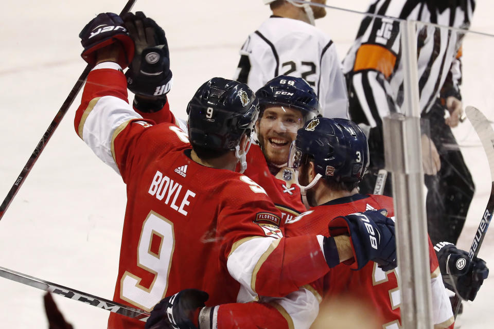 Florida Panthers center Brian Boyle (9) celebrates with left wing Mike Hoffman (68) and defenseman Keith Yandle (3) after Boyle scoreds during the third period of an NHL hockey game against the Los Angeles Kings, Thursday, Jan. 16, 2020, in Sunrise, Fla. The Panthers won 4-3. (AP Photo/Brynn Anderson)