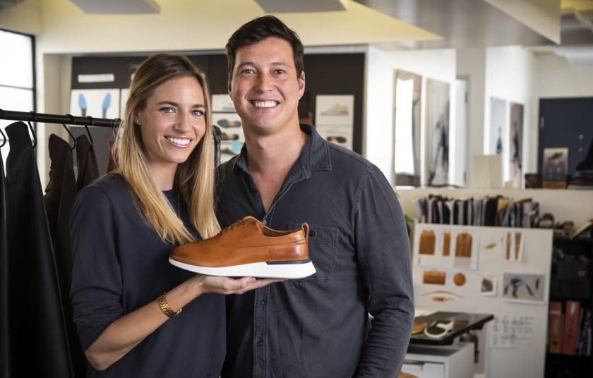 EL SEGUNDO, CA, JANUARY 23, 2020 - Justin Schneider, Founder and CEO and Hope Schneider, Co-founder and Head of Marketing, pictured with the Crossover Longwing in Honey, January 23, 2020. Wolf & Shepherd uses sneaker technology in a dress shoe. The concept behind Wolf & Shepherd is simple: quality footwear that supports your active lifestyle. With full-grain Italian leathers, classic silhouettes and the high-level craftsmanship you expect from luxury dress shoes, polished, professional style has never felt this good. (Photo By Ricardo DeAratanha / Los Angeles Times)