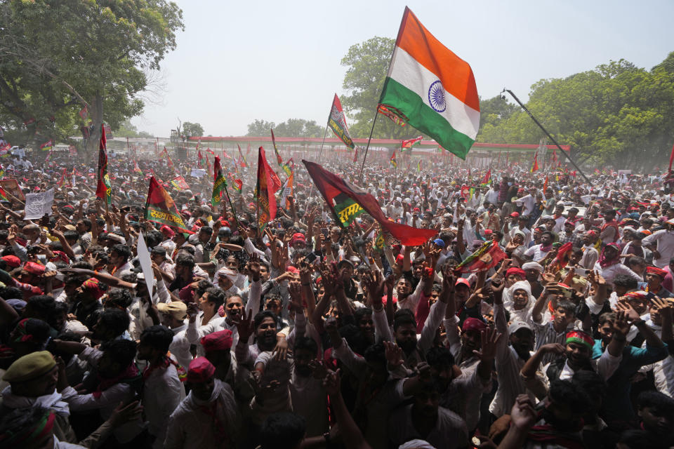 FILE-Supporters of Samajwadi Party and Indian National Congress shout slogans and wave flags at an election rally by Indian National Developmental Inclusive Alliance (INDIA) leaders Rahul Gandhi and Akhilesh Yadav in Prayagraj, Uttar Pradesh, India, Sunday, May 19, 2024. (AP Photo/Rajesh Kumar Singh,file)