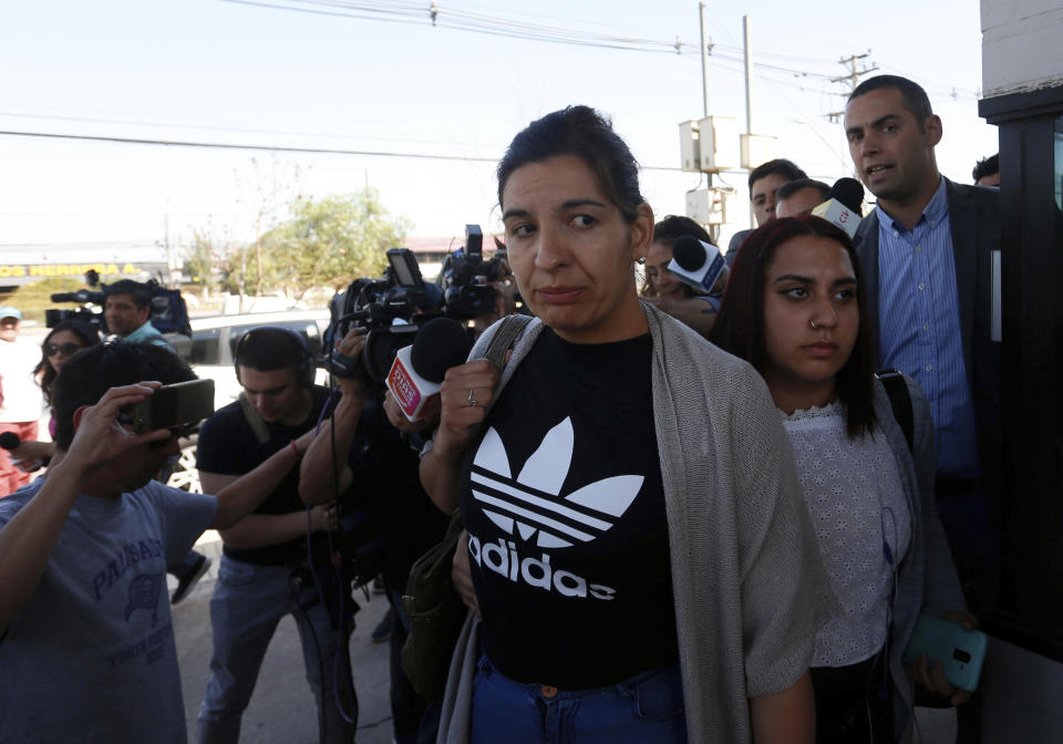 Relatives of passengers of a missing military plane arrive at the Cerrillos airbase in Santiago, Chile, Tuesday, Dec. 10, 2019. Chile's air force said it lost radio contact with a C-130 Hercules transport plane carrying 38 people on a flight to the country's base in Antarctica, and authorities are indicating they are not optimistic about the aircraft's fate. (AP Photo/Luis Hidalgo)