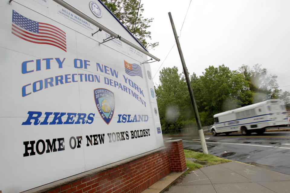 FILE - In this May 17, 2011 file photo, a bus drives past the the entrance to Rikers Island in New York. Nearly a third of Rikers Island inmates who said their visible injuries came at the hands of a correction officer last year had suffered a blow to the head, a tactic that is supposed to be a guard's last resort because it is potentially fatal, according to an internal report obtained by The Associated Press. (AP Photo/Seth Wenig, File)