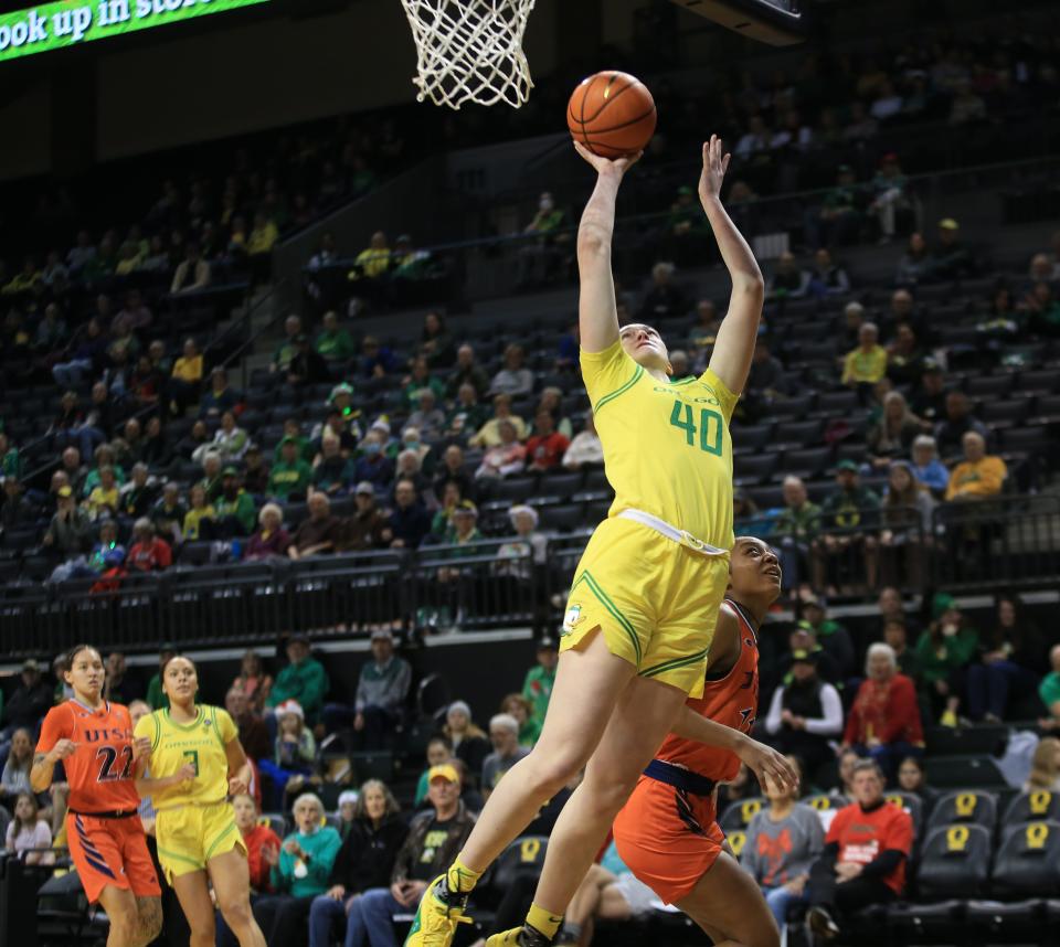 Oregon’s Grace VanSlooten, center, goes up for a shot against UTSA at Matthew Knight Arena in Eugene on Sunday.