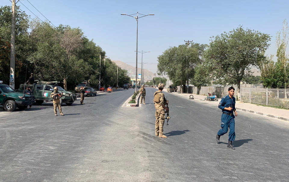 Afghan police arrive at the site of an explosion in Kabul, Afghanistan Thursday, July 25, 2019. Police say the target of the attack Thursday morning was a passenger bus belonging to the Ministry of Mines. (AP Photo/Rahmat Gul)