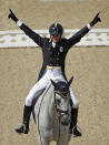 <p>Pietro Roman, of Italy, celebrates on Barraduff after competing in the equestrian eventing dressage competition at the 2016 Summer Olympics in Rio de Janeiro, Brazil, Sunday, Aug. 7, 2016. (AP Photo/John Locher) </p>