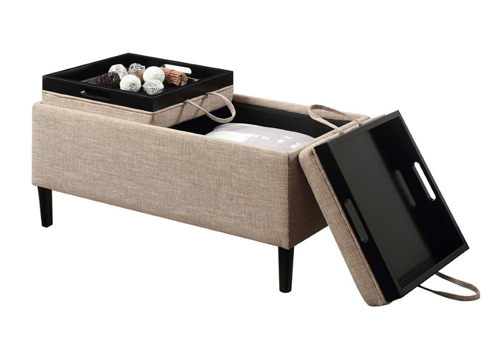 This ottoman not only has storage, but it also converts into a coffee table. 
