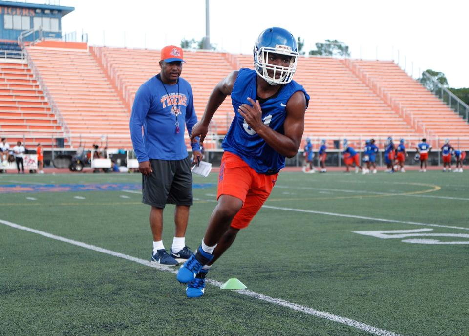 Savannah State head coach Aaron Kelton watches as true freshman linebacker Ameer Phillips runs through a drill during practice on Monday at T.A. Wright Stadium.