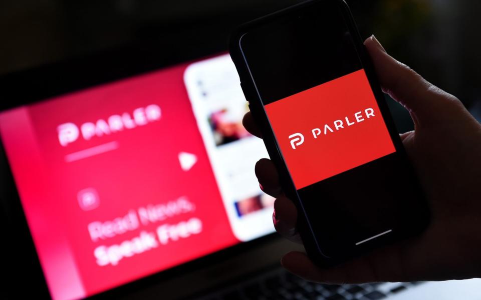 Parler was taken offline last week and has struggled to return - AFP