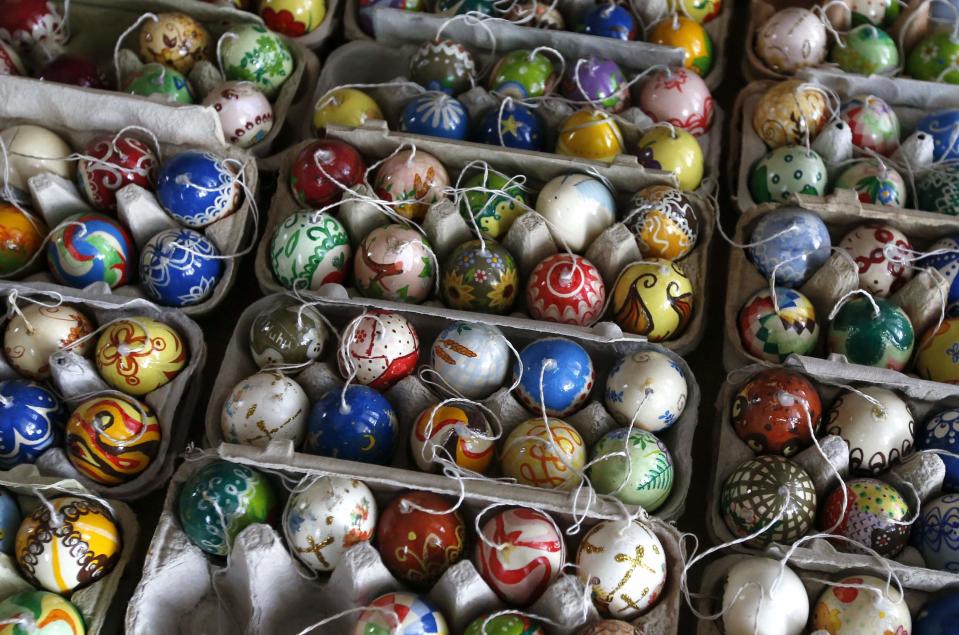 Part of the collection of Easter eggs of German pensioners Christa and Volker Kraft are displayed before they decorate an apple tree with them at their summerhouse in the eastern German town of Saalfeld, March 19, 2014. Each year since 1965 Volker and his wife Christa spend up to two weeks decorating the tree with their collection of 10,000 colourful hand-painted Easter eggs in time for Easter celebrations. REUTERS/Fabrizio Bensch